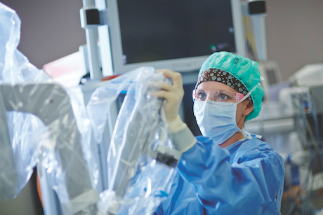 Doctor prepares for robotic surgery